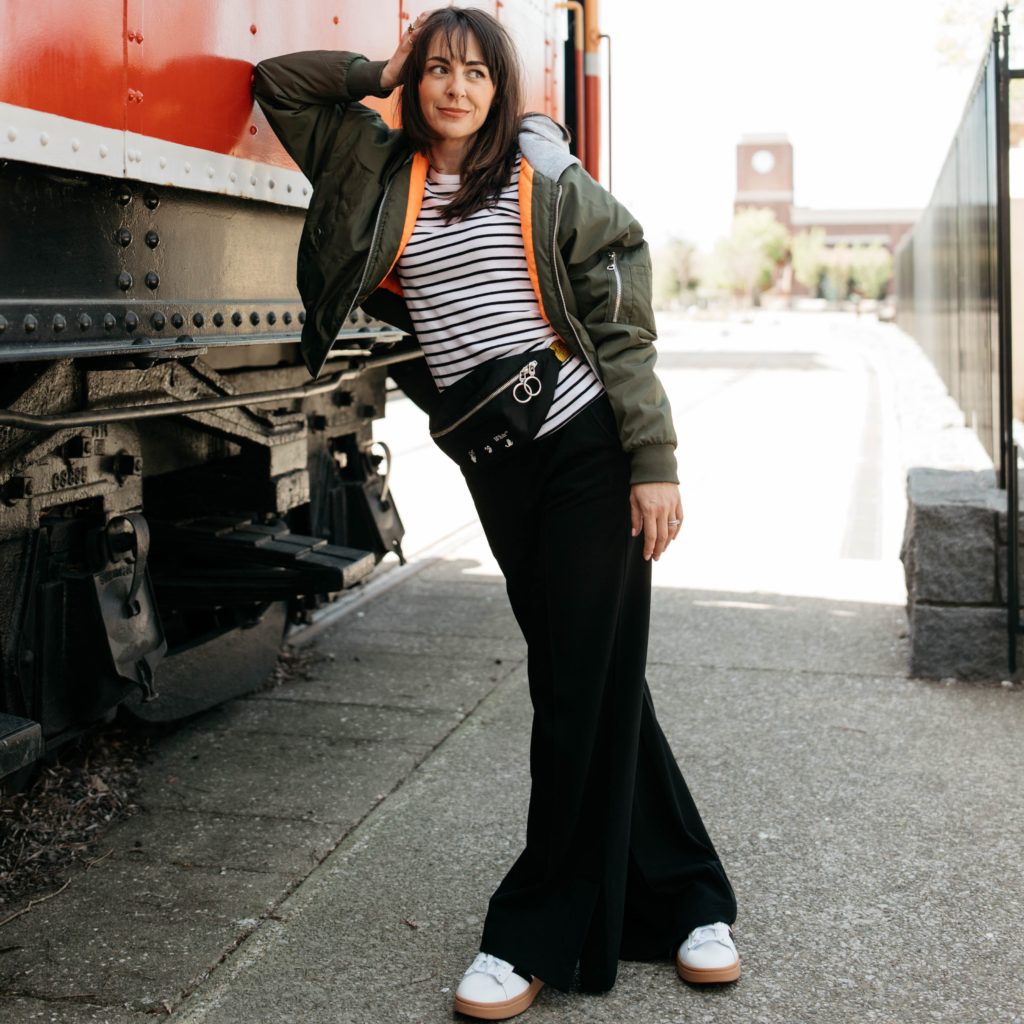 street style
travel outfit black pull on pants black and white striped t shirt off white belt bag green hoodie bomber jacket folsom train station folsom ca t