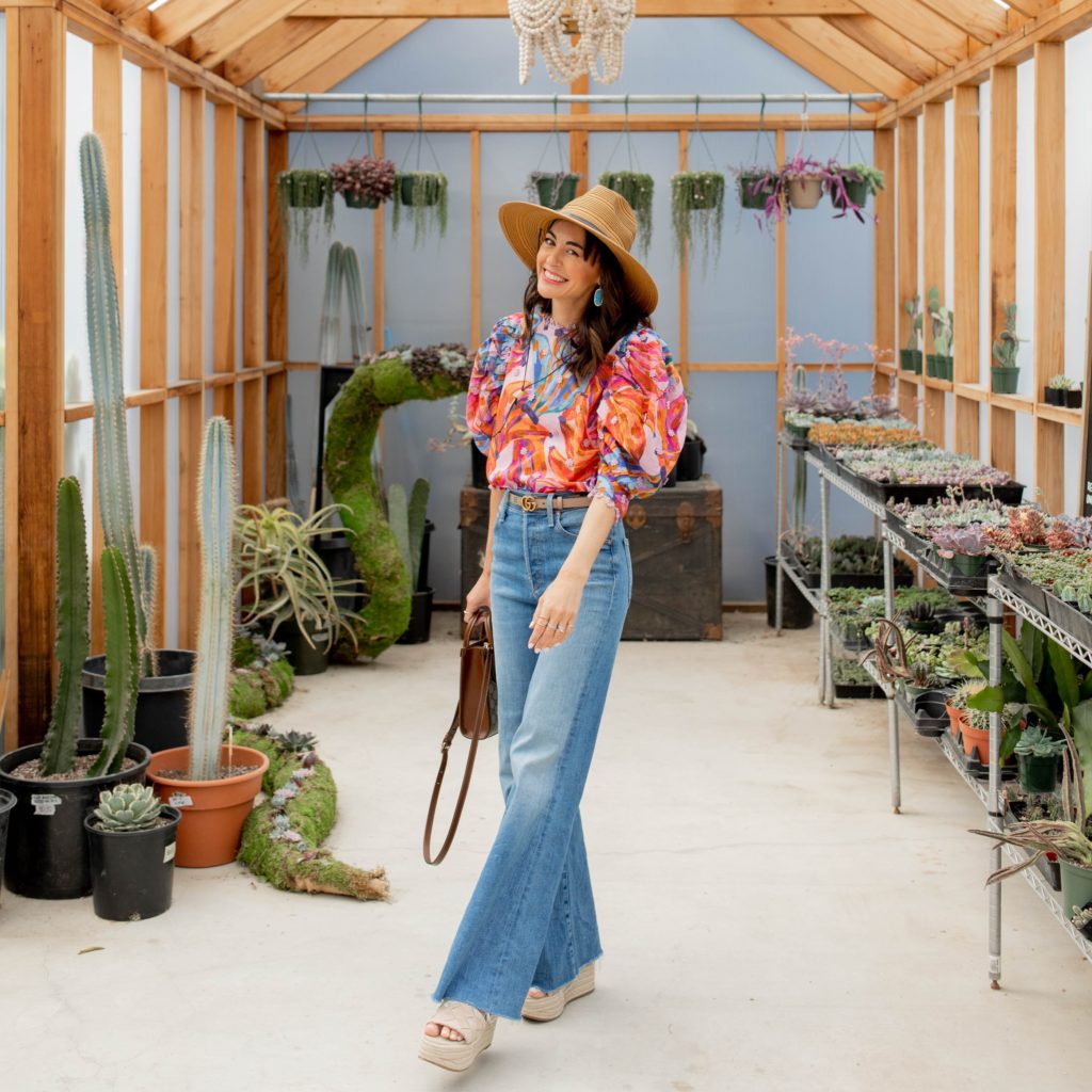 Jennifer Sattler Stylist at the Prickly Pear in Sacramento CA wearing Mother tomcat roller wide leg flare jeans sun hat farm rio pink top gucci blet and gucci purse shopping for succulents Marc fisher plastform sandals summer trends 2022