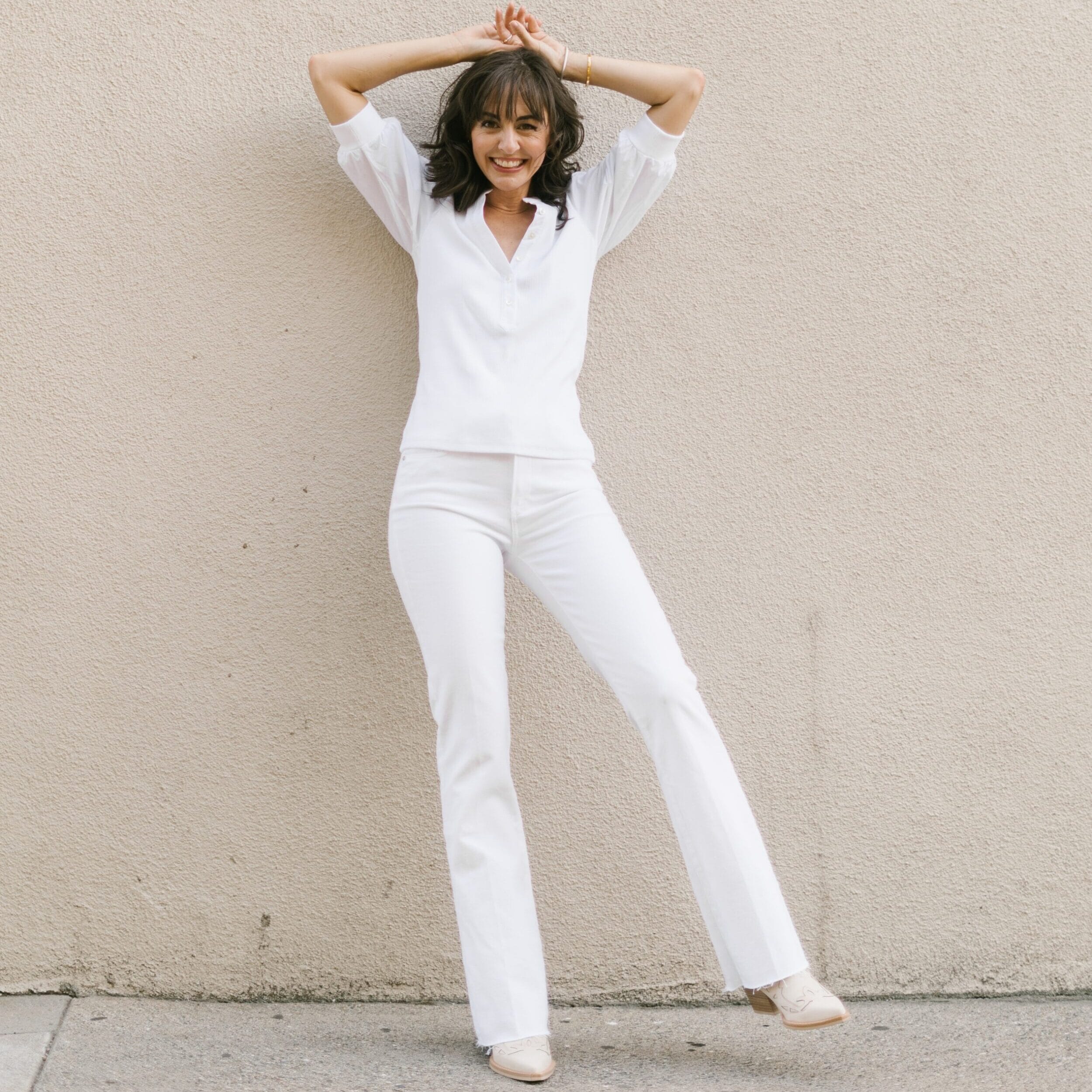 jennifer sattler wearing an all white jeans outfit and white puff sleeve veronica beard top
